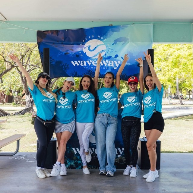 The team together under a foundation banner after a cleanup